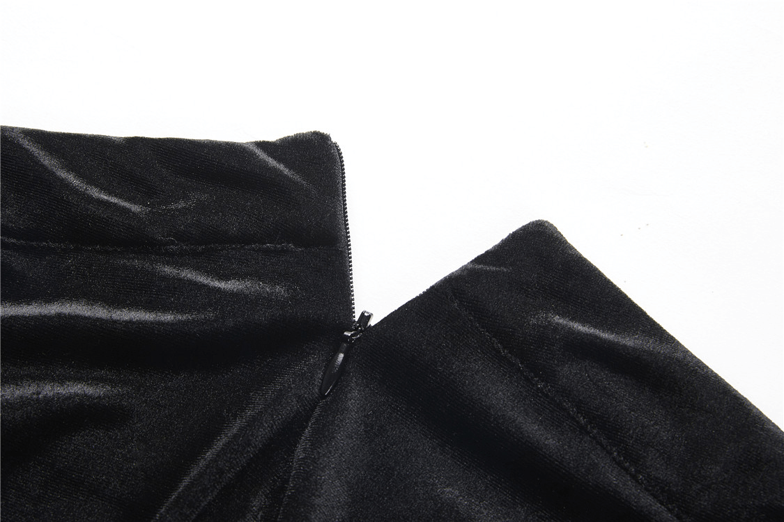 Close-up of black velvet fishtail skirt zipper, showcasing luxurious fabric and elegant design, perfect for gothic fashion.