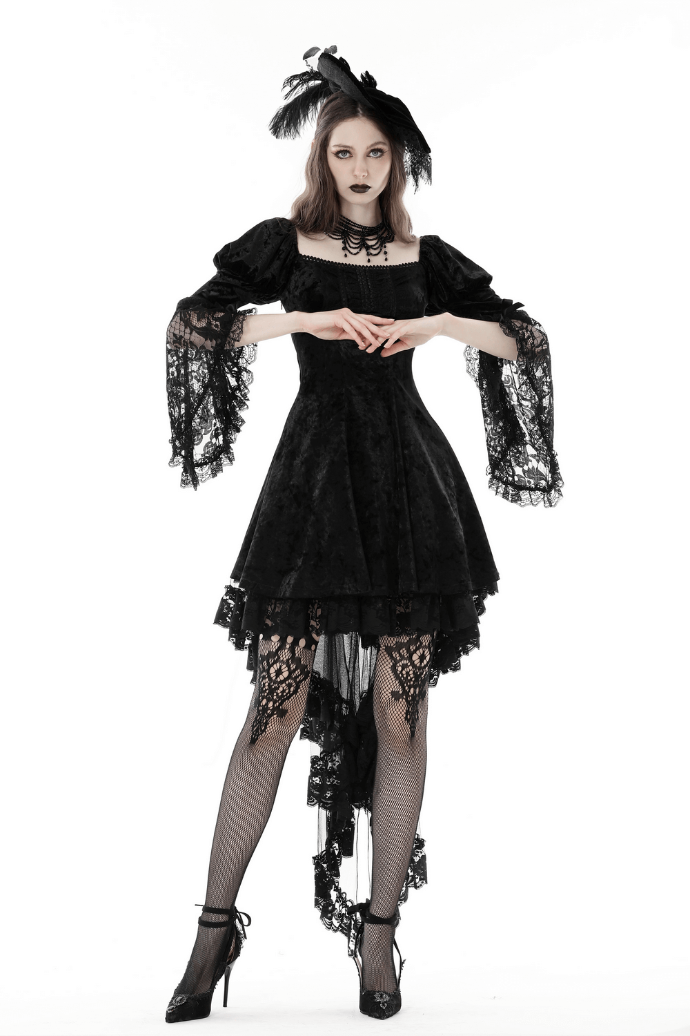 Dark Gothic velvet mini dress with sheer lace sleeves and flared skirt, perfect for a stylish night out.