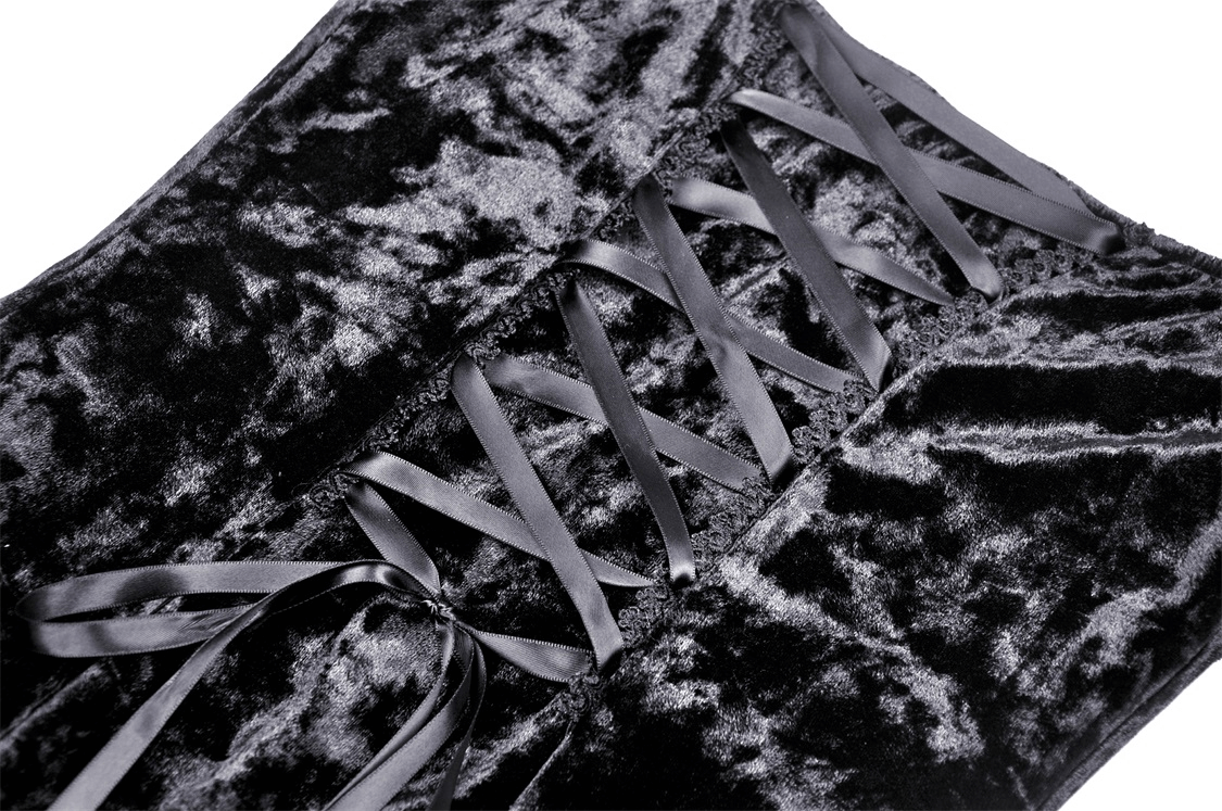 Close-up of black velvet lace-up detail on gothic mini dress showcasing luxurious fabric and elegant design.