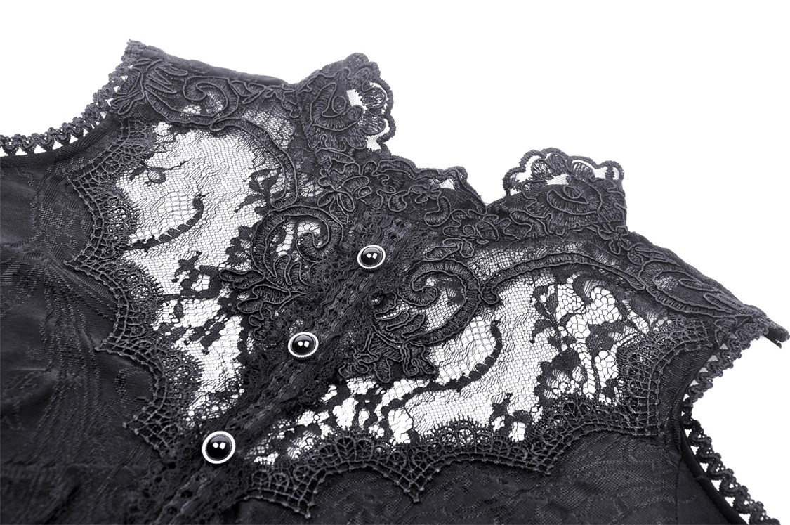Close-up of intricate black lace detailing on a Gothic off-shoulder top with buttons and elegant patterns.