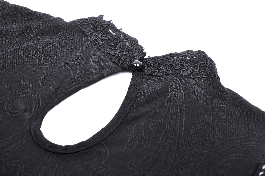 Close-up of the elegant lace neckline and keyhole detail of the dark lace Baroque off-shoulder top.