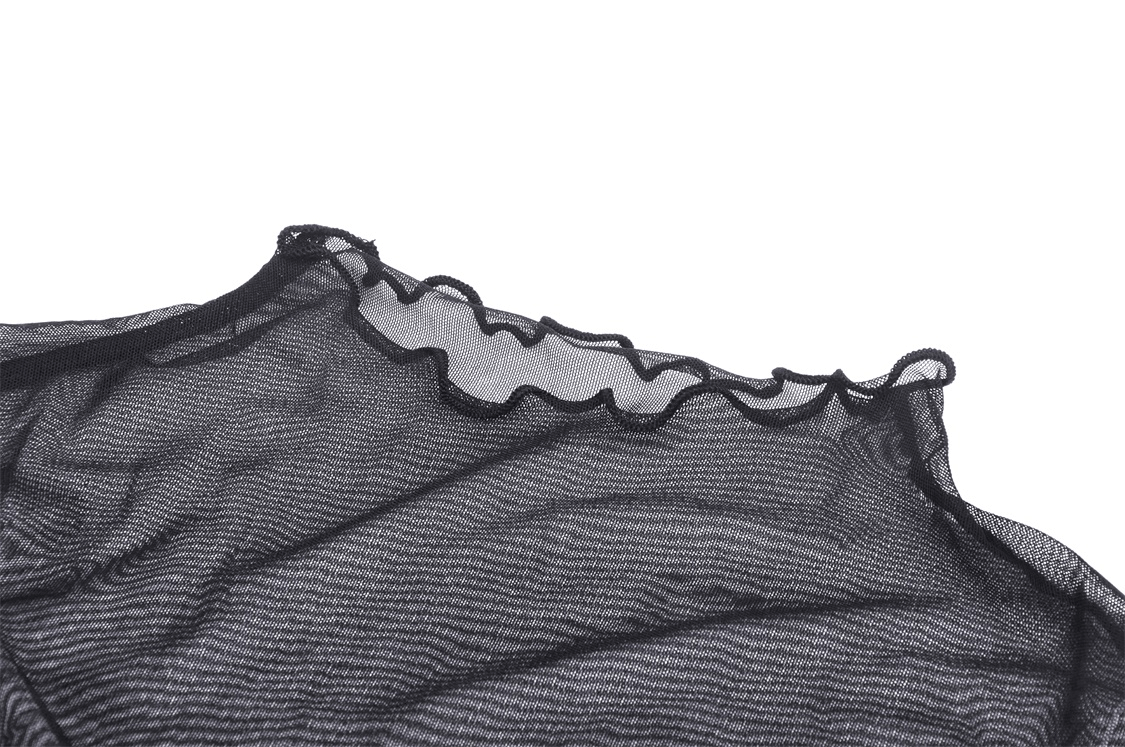 Close-up of the sheer black mesh fabric and ruffled neckline of a gothic fishnet crop top.