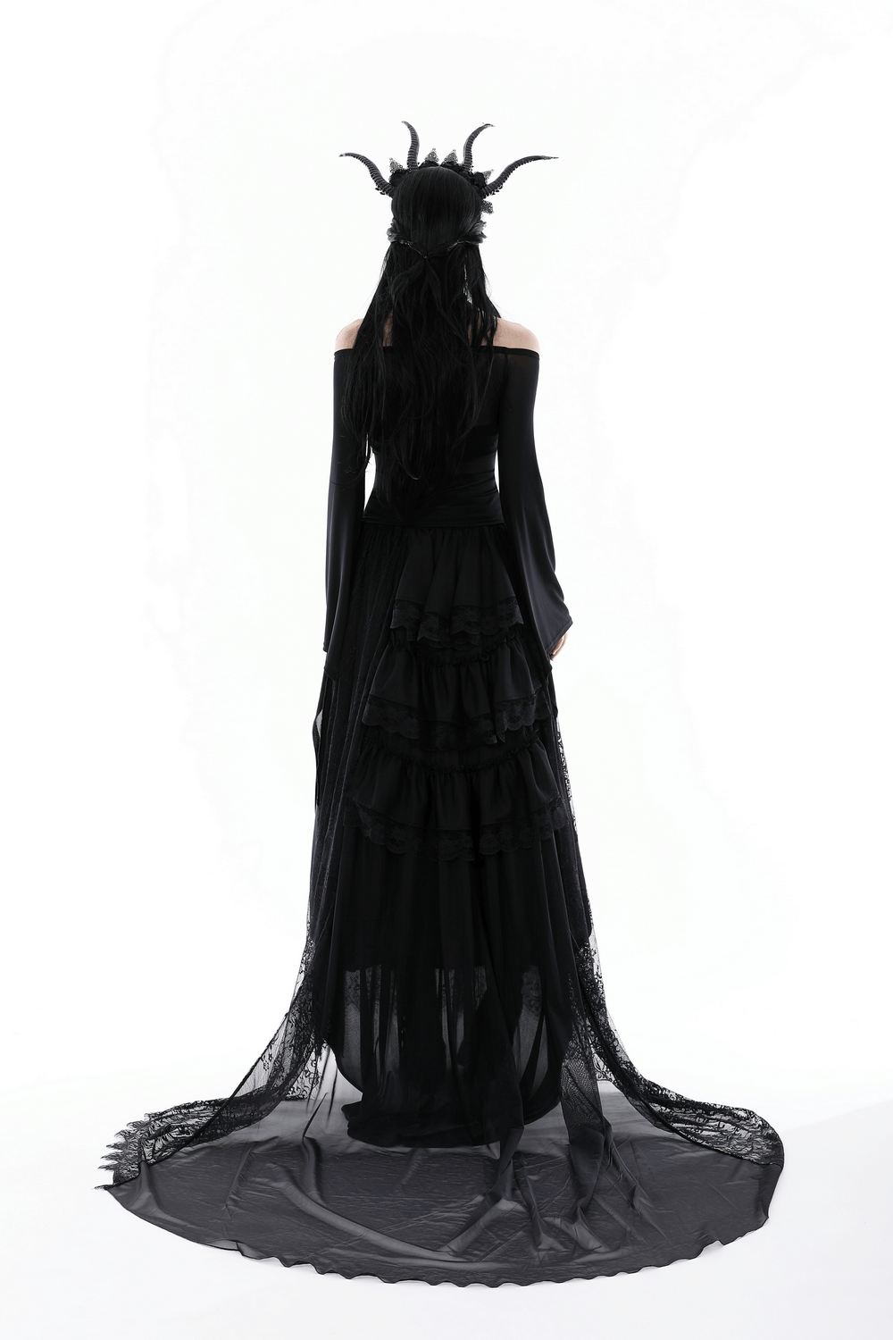 Model showcasing a gothic black mesh off-the-shoulder top with trumpet sleeves, perfect for dark, dramatic fashion.
