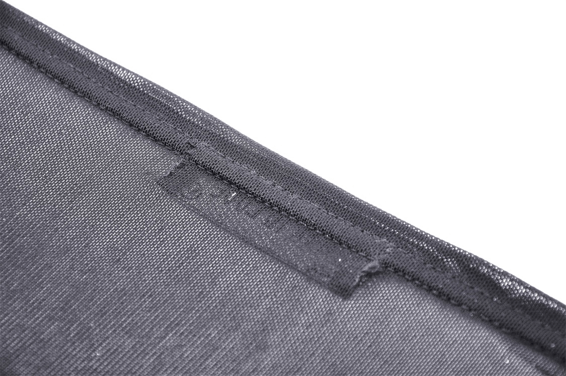 Close-up of black mesh fabric showcasing delicate texture for Gothic fashion tops.