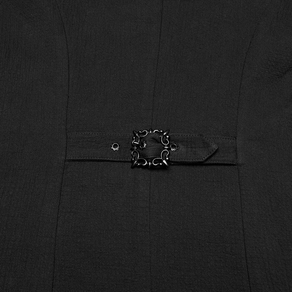 Close-up of luxurious black vest detail with intricate bat buckle for gothic vampire aesthetic.