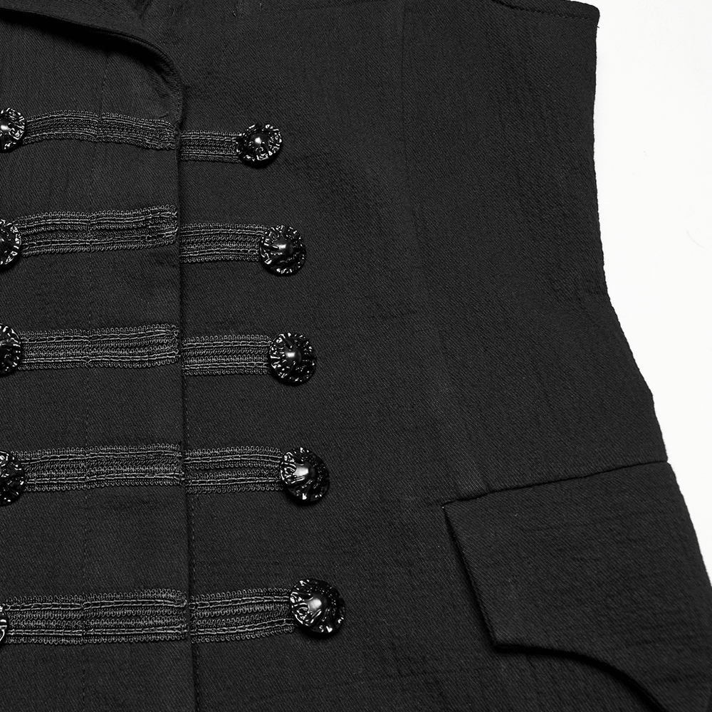 Close-up of dark vest featuring intricate woven straps and hand-sewn buckles for a gothic, gentlemanly style.