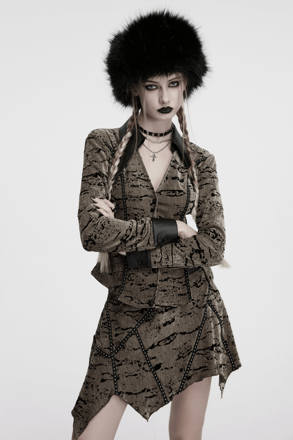 Model showcasing dark plush punk hat with ear protection, tattered mesh outfit, and edgy accessories.