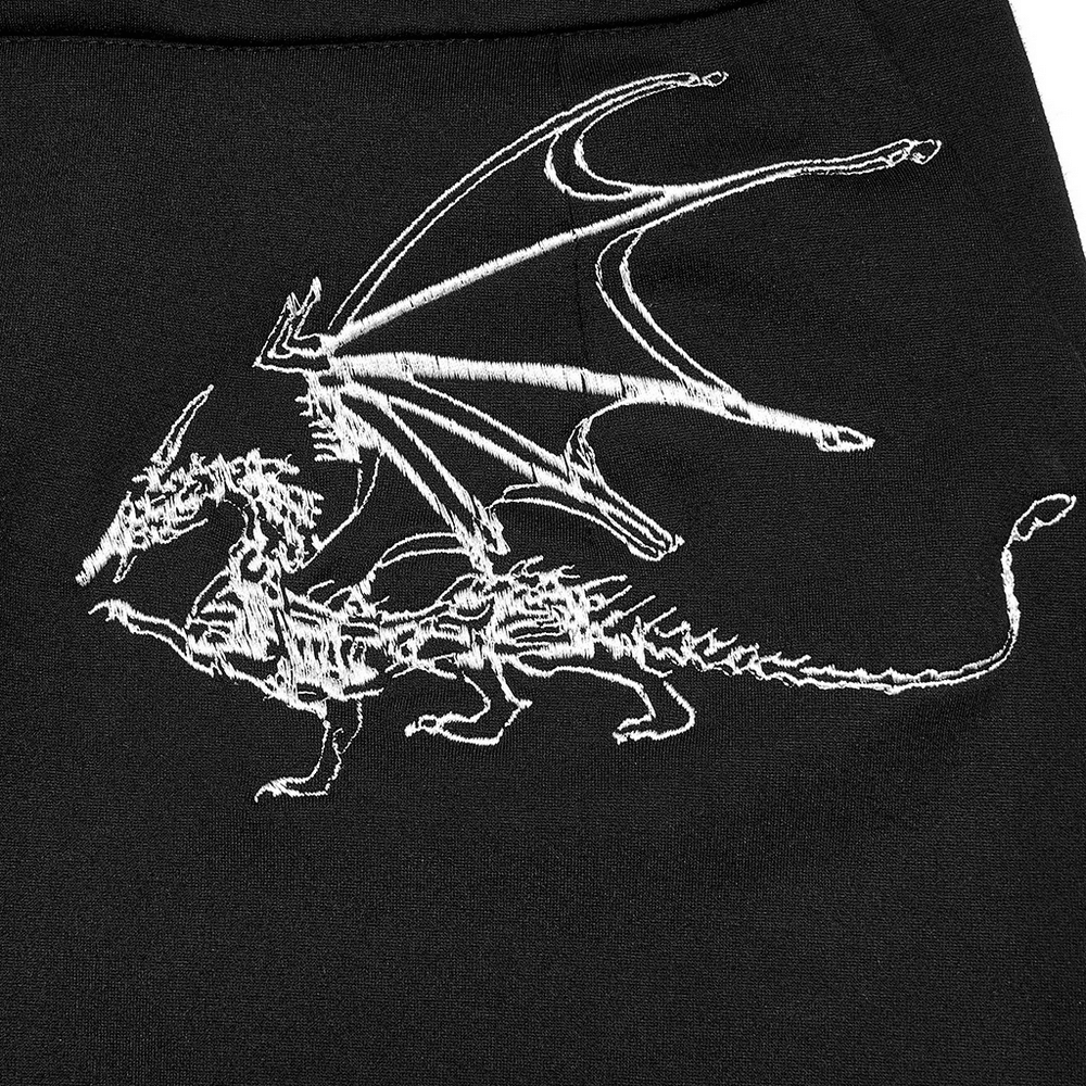 Elegant black skirt featuring intricate white dragon embroidery, showcasing a unique dark punk style.