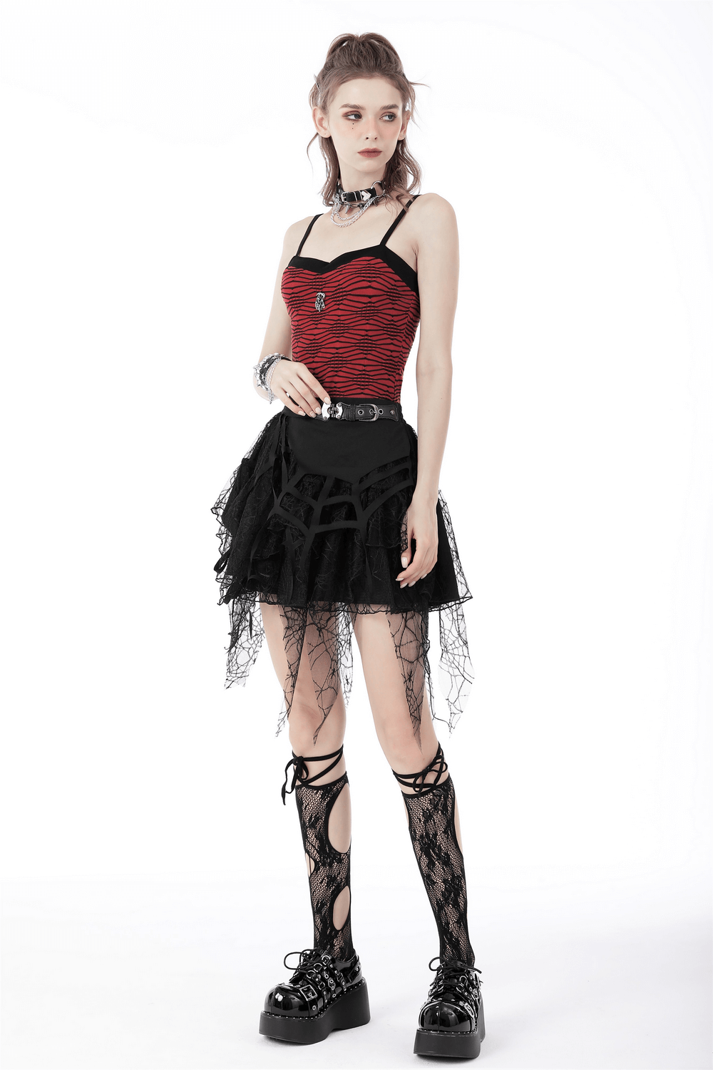 Model showcasing dark punk lace spiderweb mini skirt with edgy belt detail and matching black accessories.