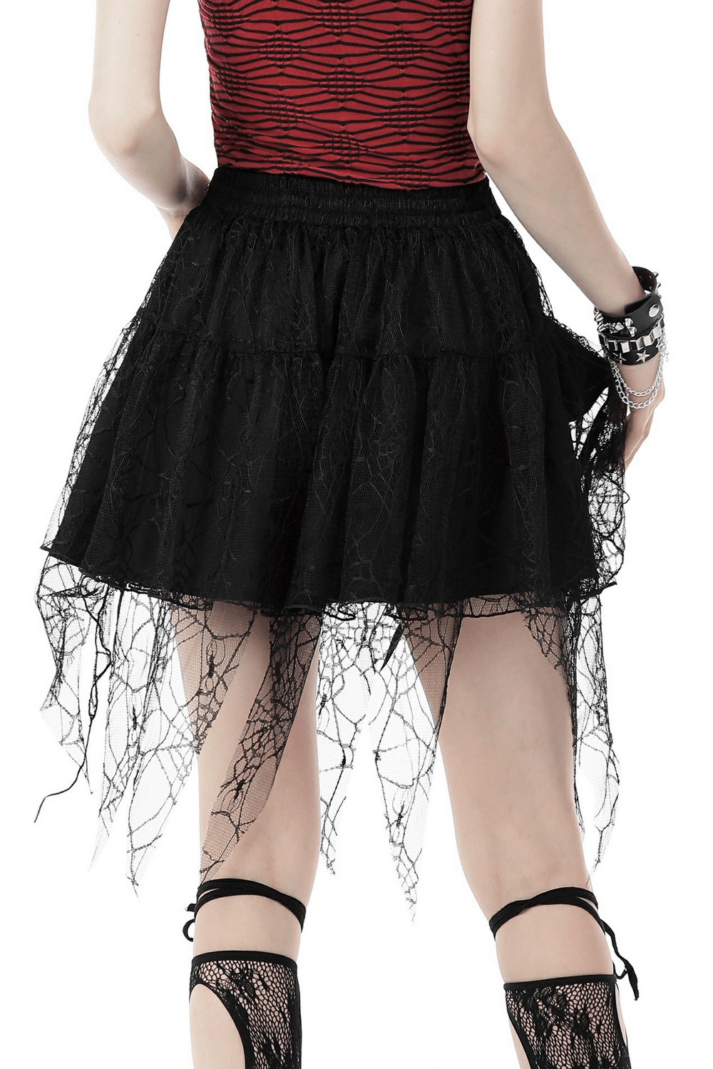 Black gothic lace mini skirt with spiderweb detail, showcasing a playful edgy style perfect for a dark punk look.