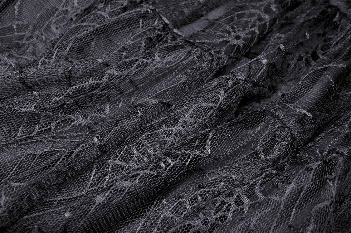 Close-up of black lace fabric featuring an intricate spiderweb design, perfect for gothic fashion enthusiasts.