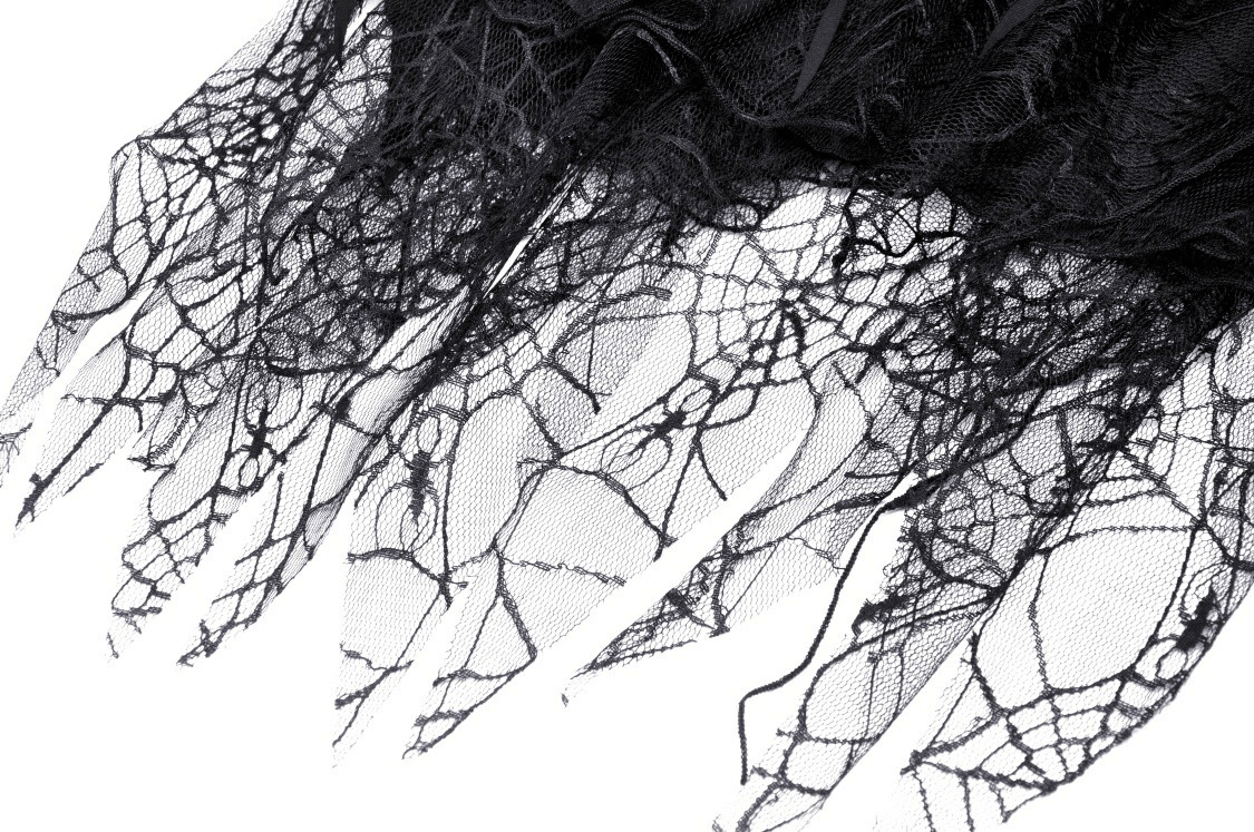 Close-up of intricate black lace with spiderweb design, perfect for gothic fashion lovers.