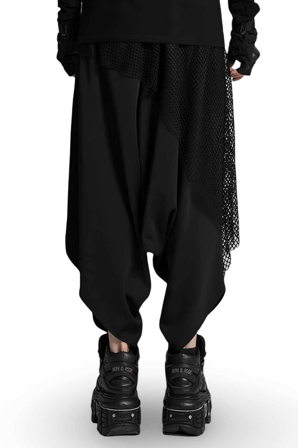 Stylish dark punk harem pants with mesh layers, featuring a unique hanging design and decorative zippers, paired with chunky black boots.