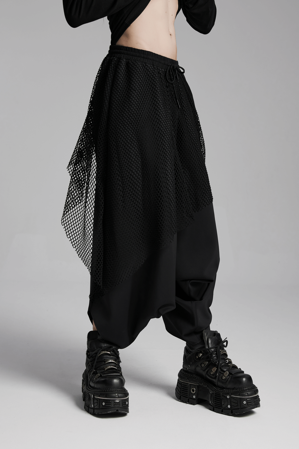 Dark punk loose fit harem pants with mesh layers and edgy boots, perfect for high-street fashion enthusiasts.