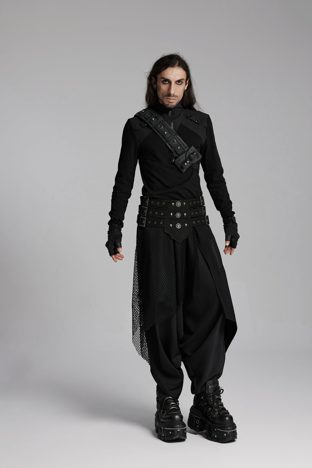 Model wearing dark punk loose fit harem pants with mesh layers, styled in bold Gothic streetwear.