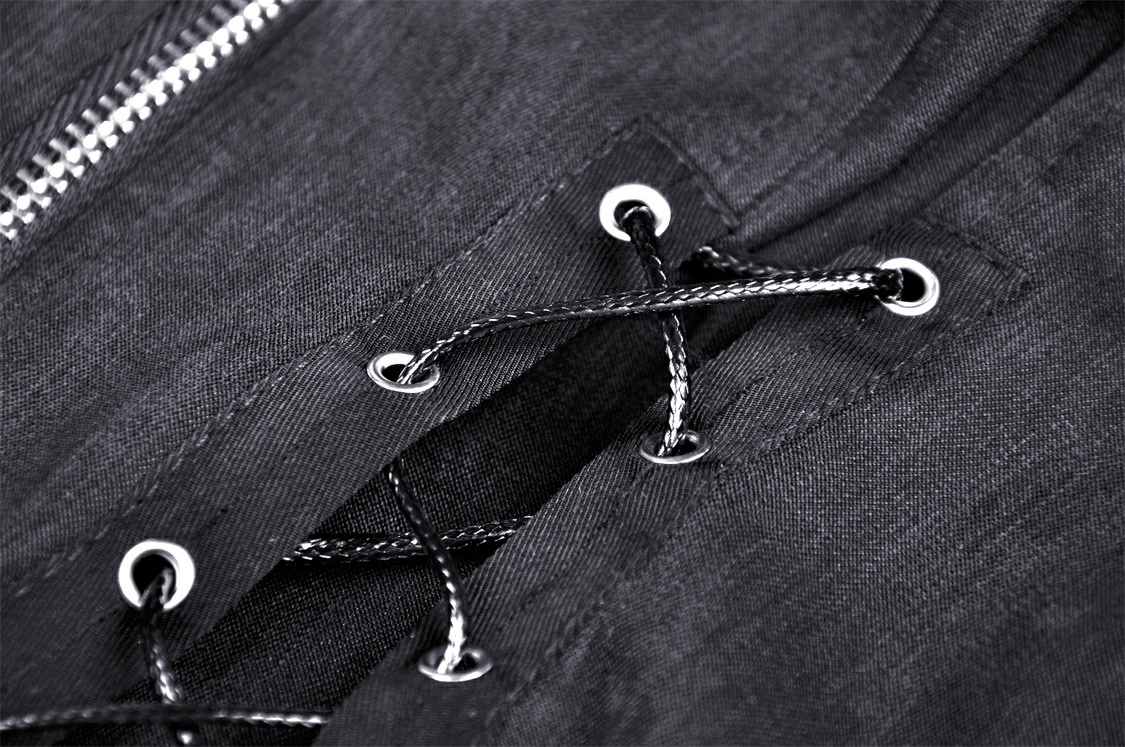 Close-up of dark punk crop top's lace-up detailing and metal zipper, showcasing gothic fashion elements.