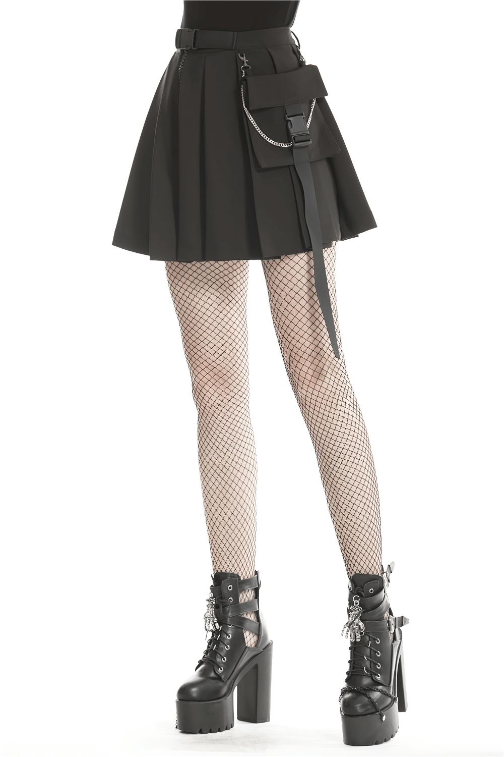 Dark punk pleated mini skirt with chain detail, paired with fishnet stockings and platform boots.