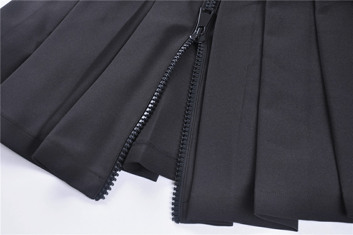 Close-up of dark punk pleated mini skirt zipper and pleats showcasing edgy fashion details.