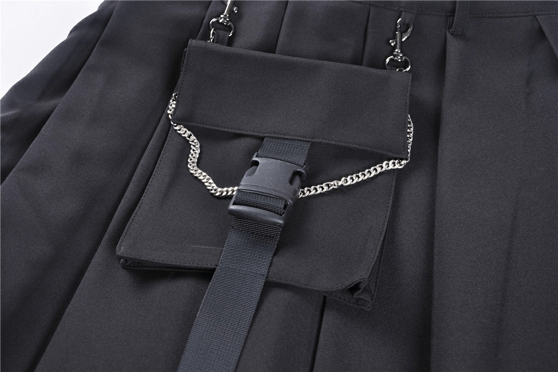 Close-up of a black pleated mini skirt showing edgy chain detail and pocket for stylish punk flair.