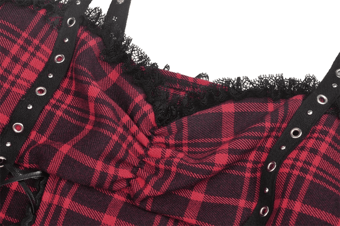Close-up of a red and black plaid mini dress with eyelet details and metal accents for a goth punk style.