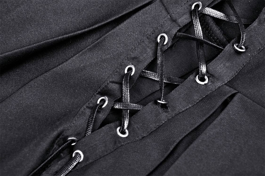 Close-up of lace-up buckle detailing on a dark punk suspender skirt, perfect for edgy goth fashion.
