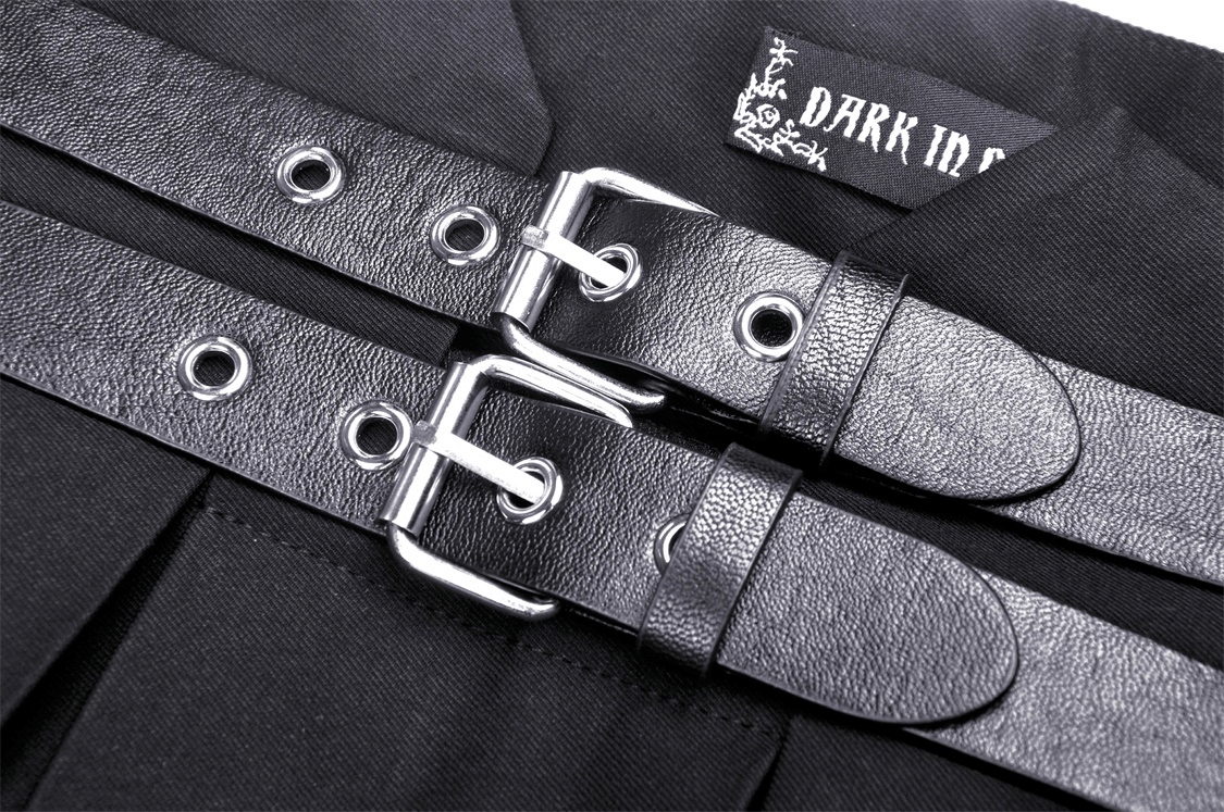 Close-up of black buckle straps on a dark punk suspender skirt, showcasing gothic and edgy fashion details.