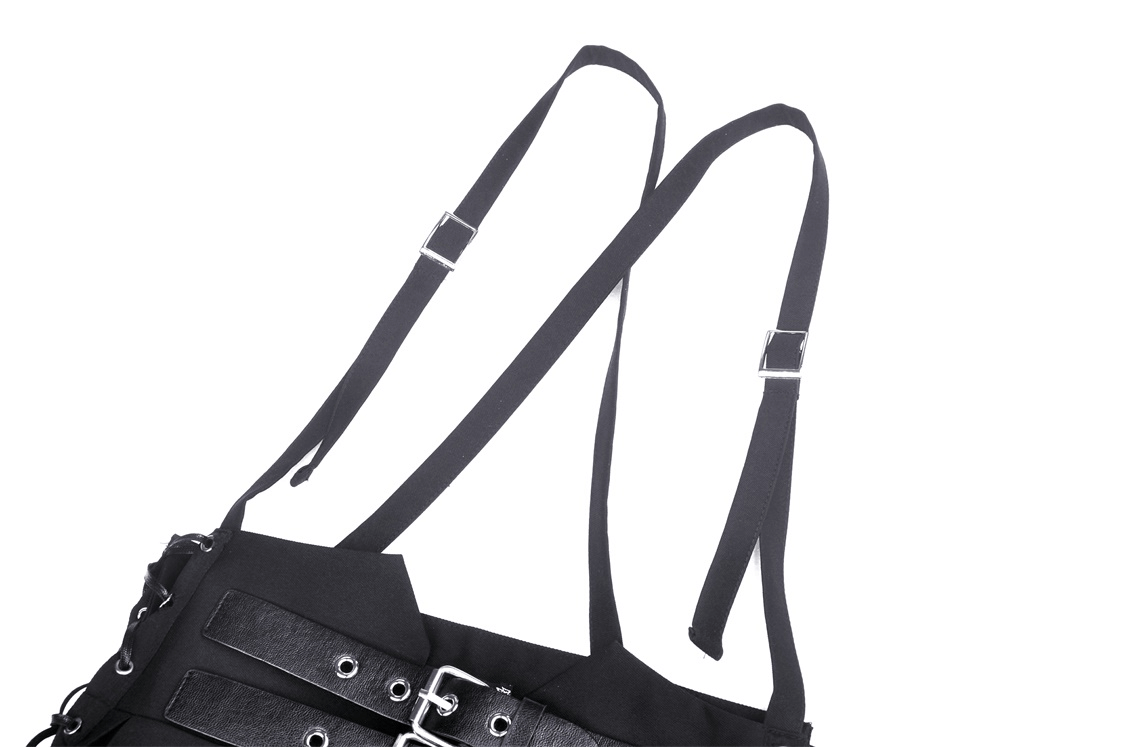 Close-up of black suspender straps with buckle detailing from a dark punk pleated skirt.