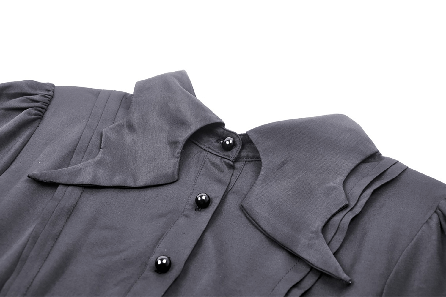 Close-up of a dark ruffled neckline dress featuring button detail for a gothic-inspired look.