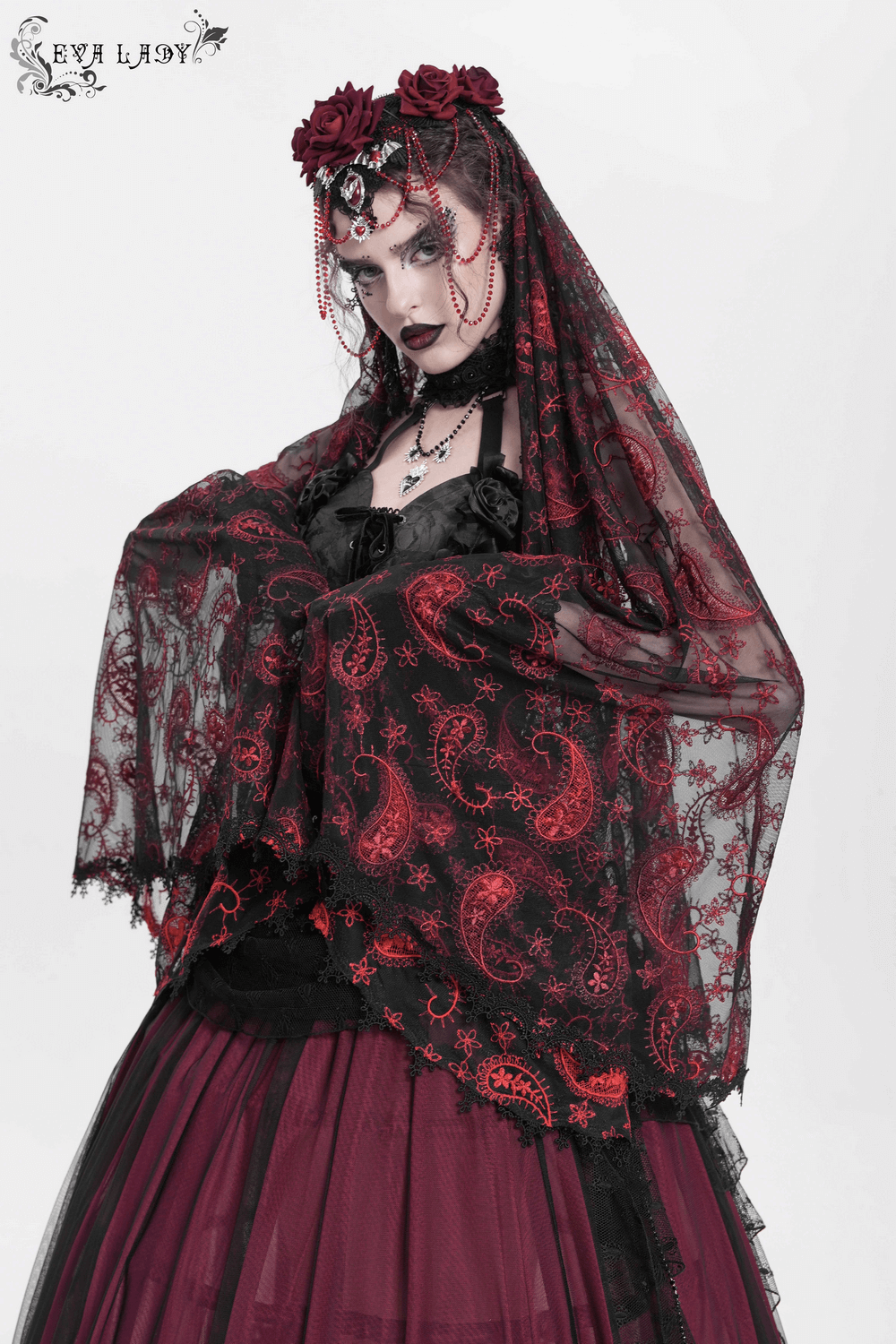 Dark romantic embroidered veil with skull pendant, red roses, and beaded chains on sheer black lace.