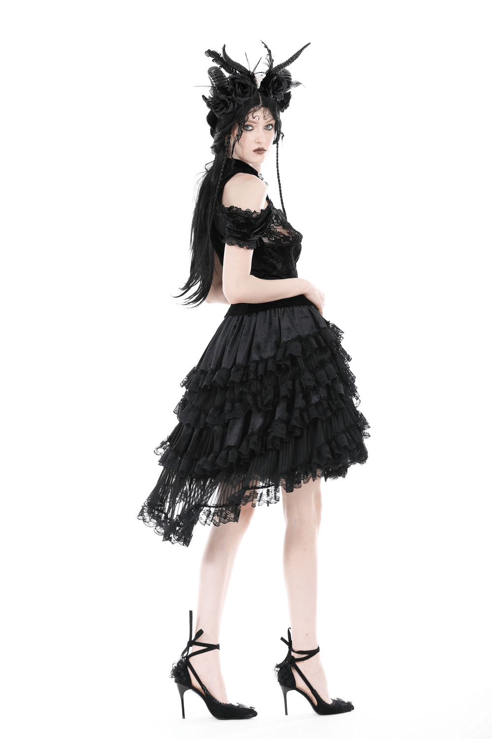 Gothic dark romantic women's black lace high-low skirt with dramatic ruffles and stylish embellishments.