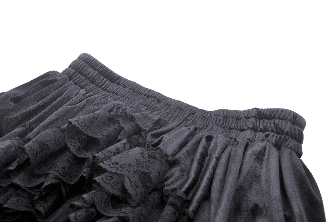 Close-up of a dark romantic black lace high-low skirt with dramatic ruffles and an elastic waistband.