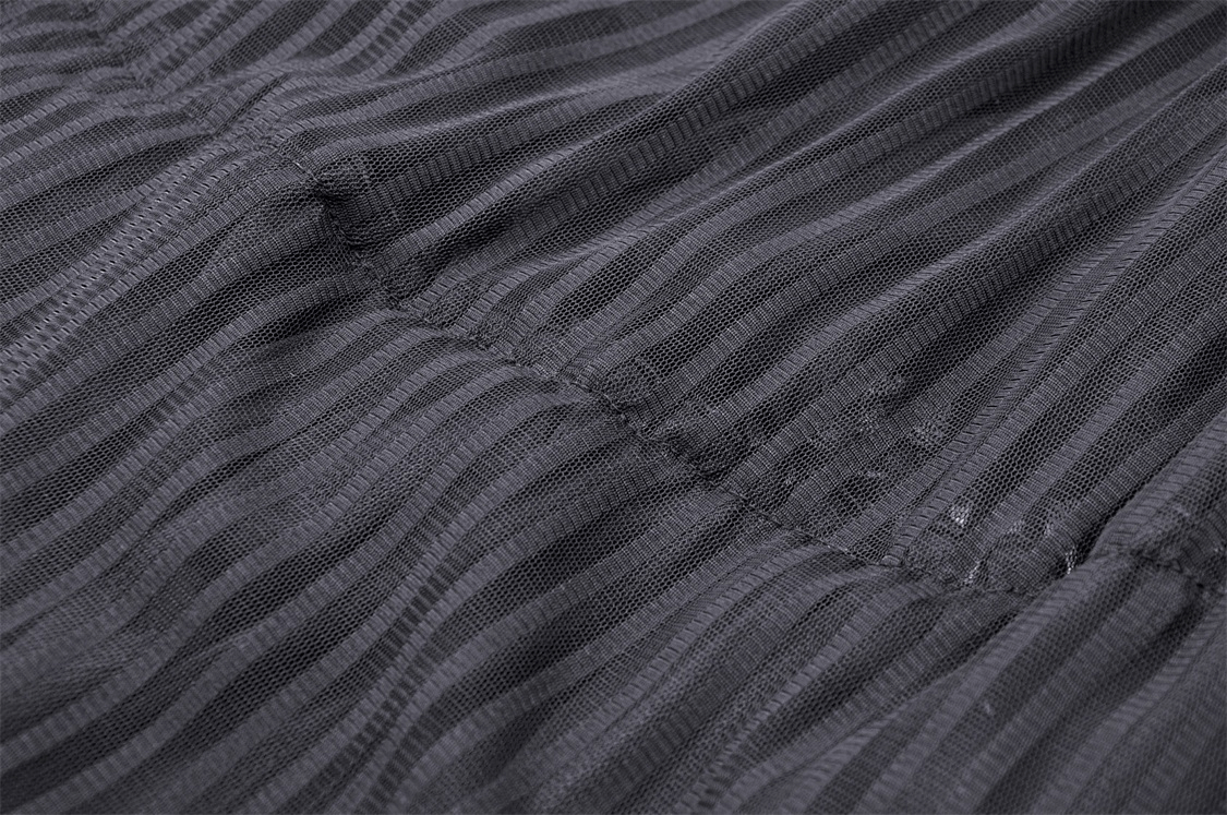 Close-up of dark gray lace fabric, showcasing intricate textured stripes and delicate detailing.