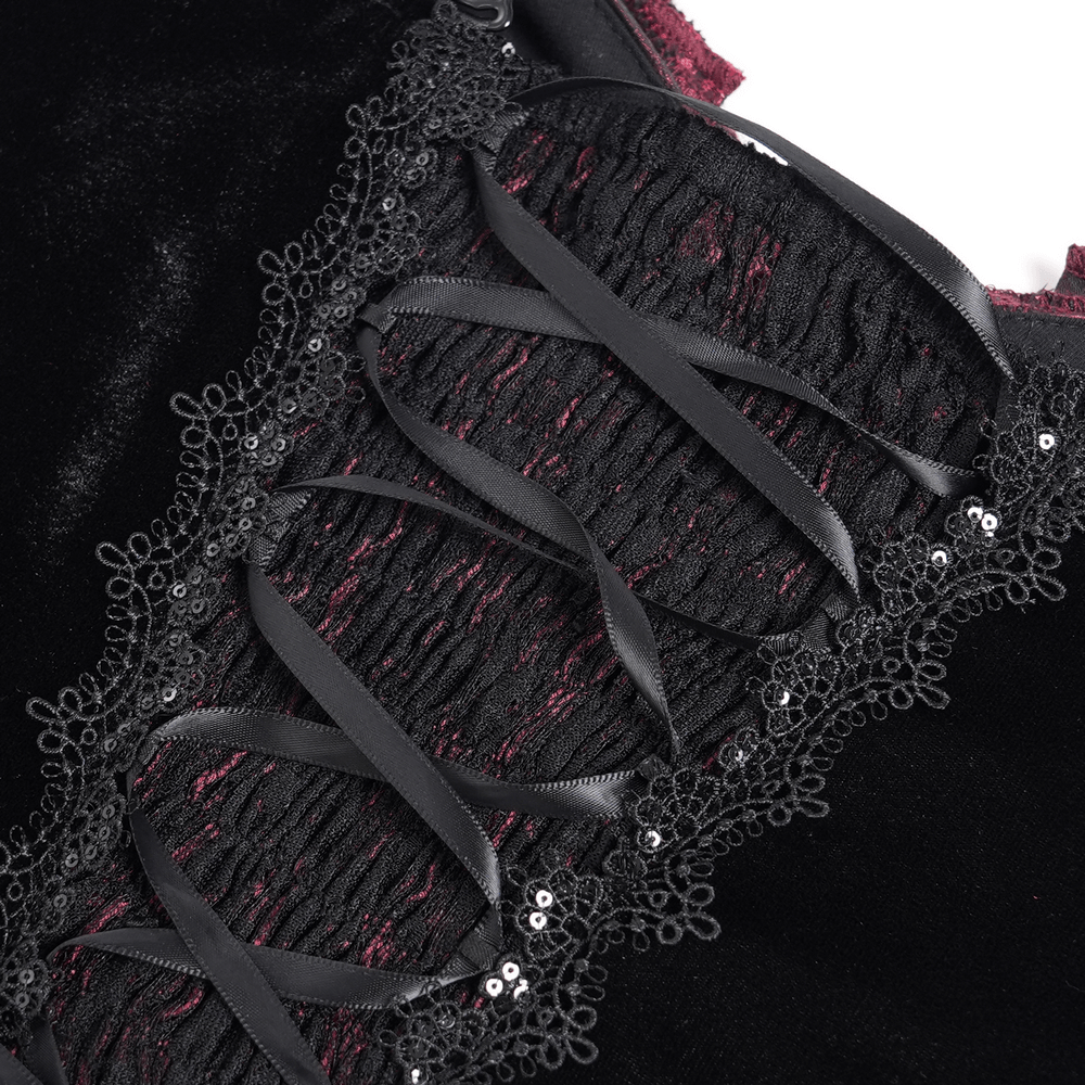 Close-up of black velvet corset with lace detailing and ribbon lacing, showcasing gothic romantic fashion.
