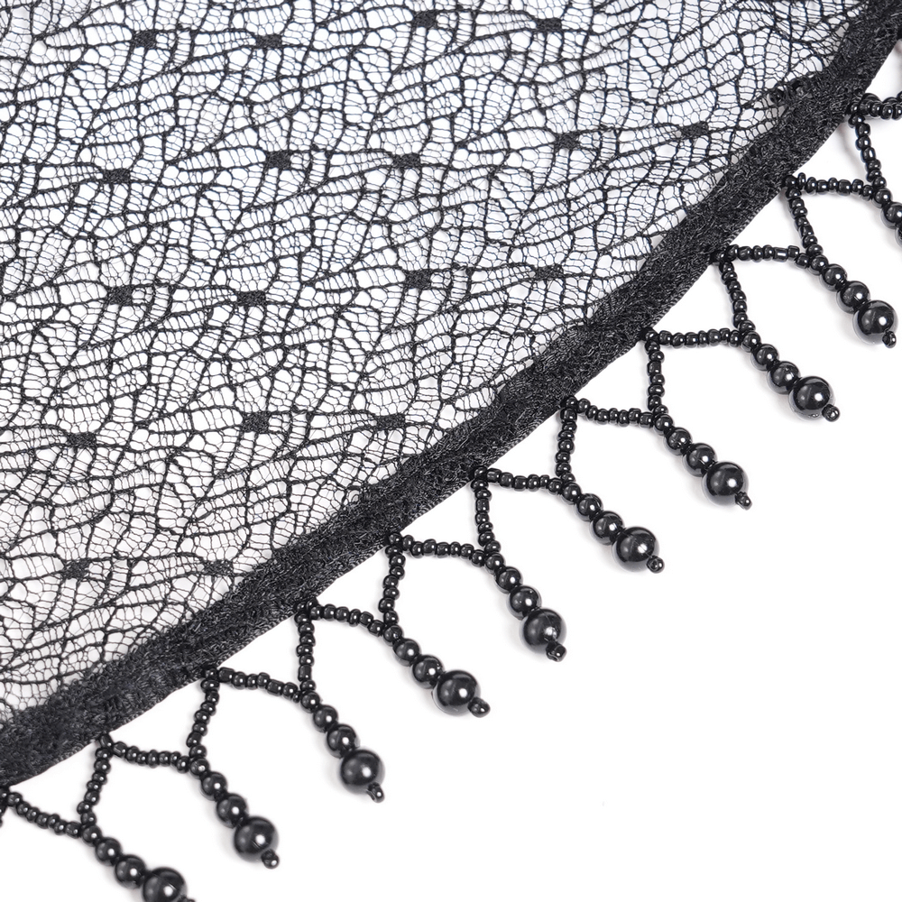 Close-up of intricate black lace with beaded fringe, perfect for gothic or romantic fashion designs.