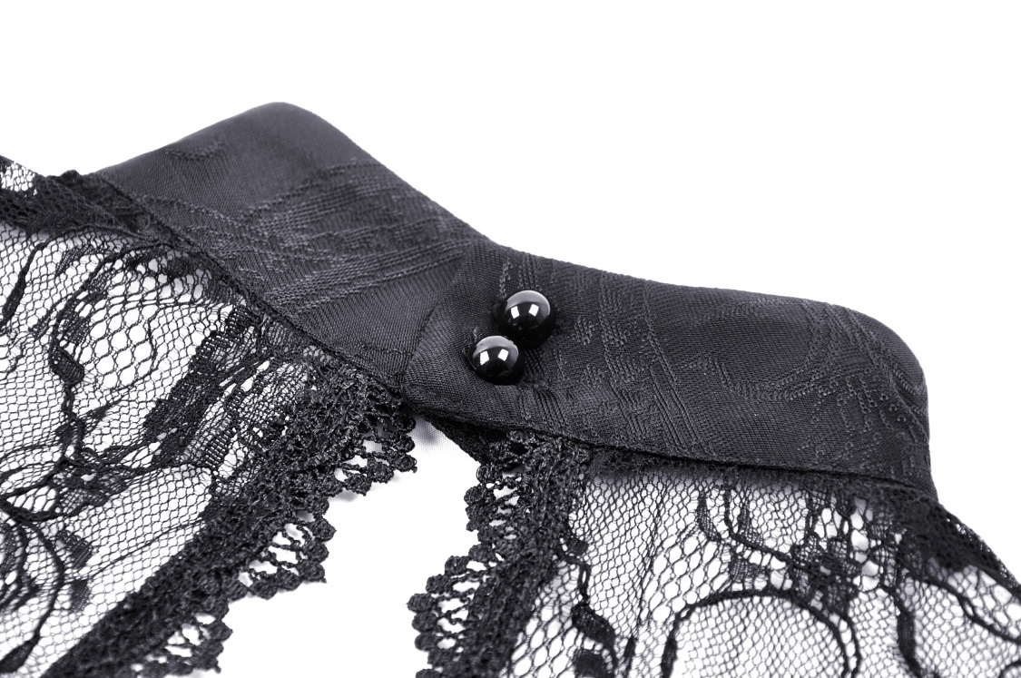 Close-up of black lace top collar with decorative buttons, perfect for a gothic fashion statement.