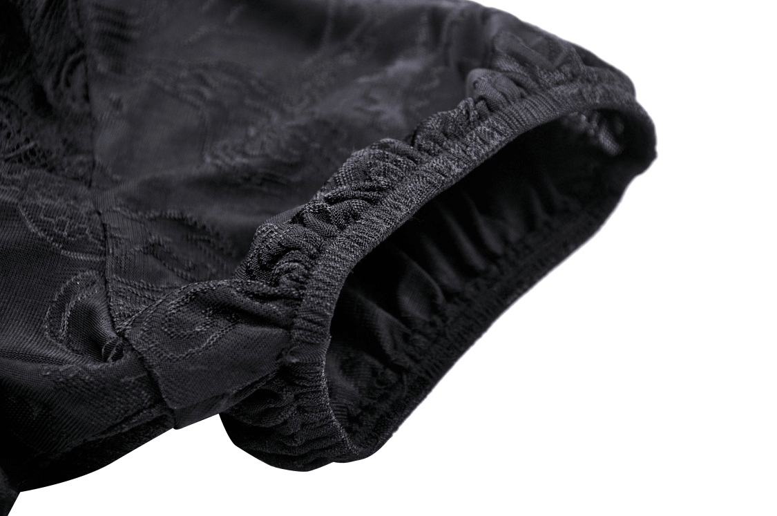 Close-up of short puff sleeve on a dark romantic gothic lace top, showcasing delicate black lace details.