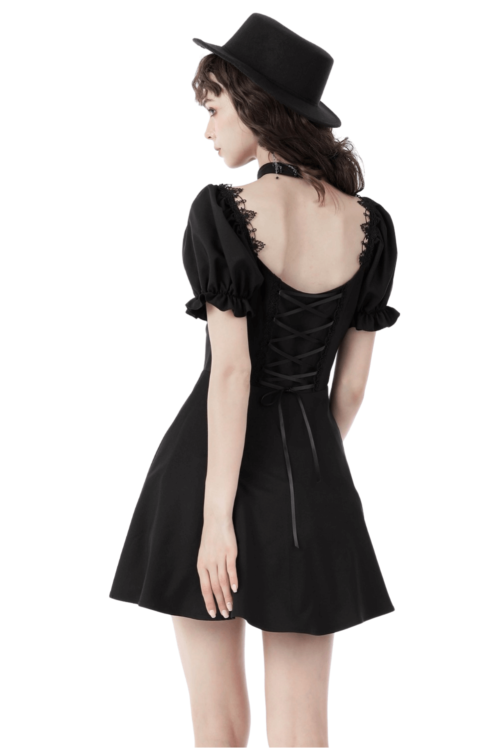 Back view of dark romantic gothic puff sleeve dress with ribbon bow, featuring lace-up details and a flirty skirt.