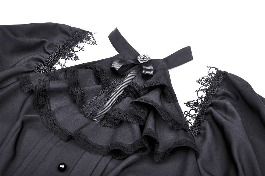 Close-up of gothic puff sleeve dress with lace trim, collar, and satin ribbon bow accent.