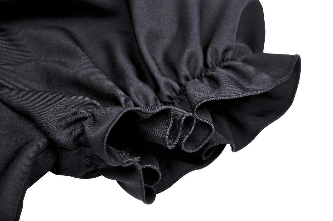 Close-up of the puff sleeve detailing on a black gothic dress, highlighting elastic cuffs and soft fabric.