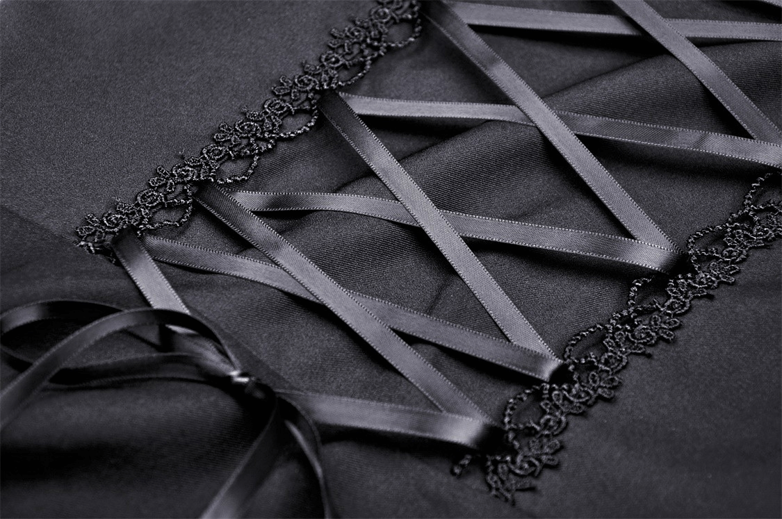 Close-up of black ribbon lacing and lace detailing on a gothic dress, perfect for a romantic gothic style.