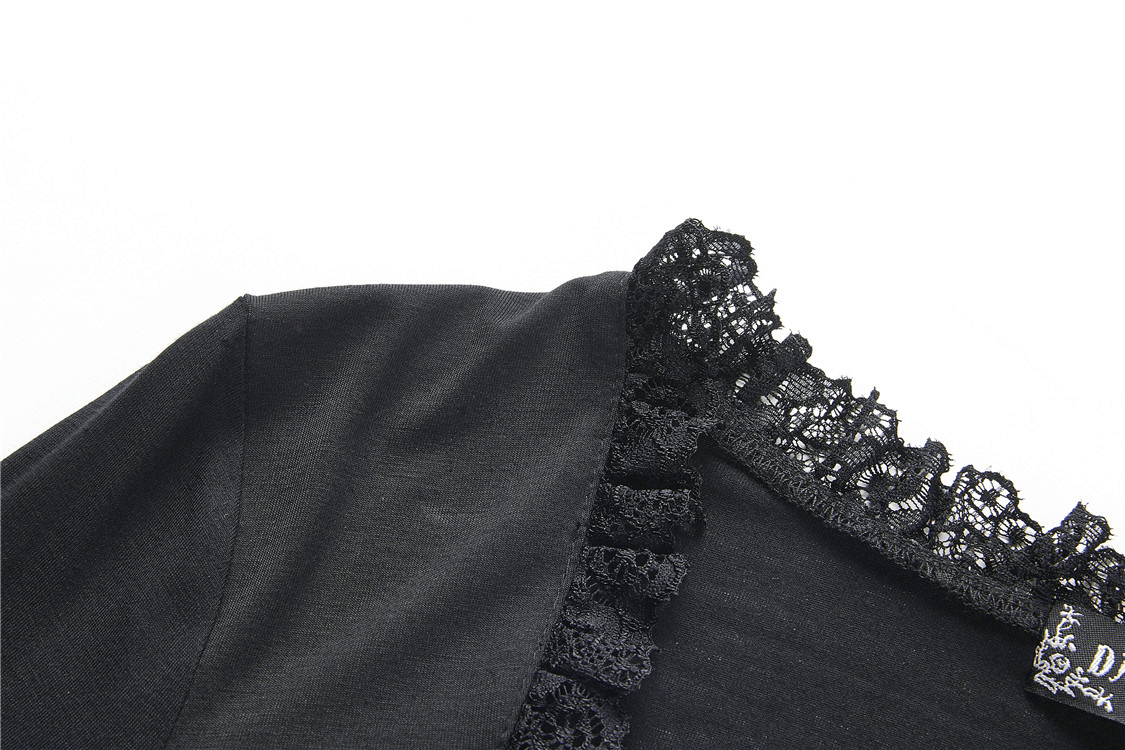 Close-up of a black lace top featuring intricate lace detailing along the neckline.
