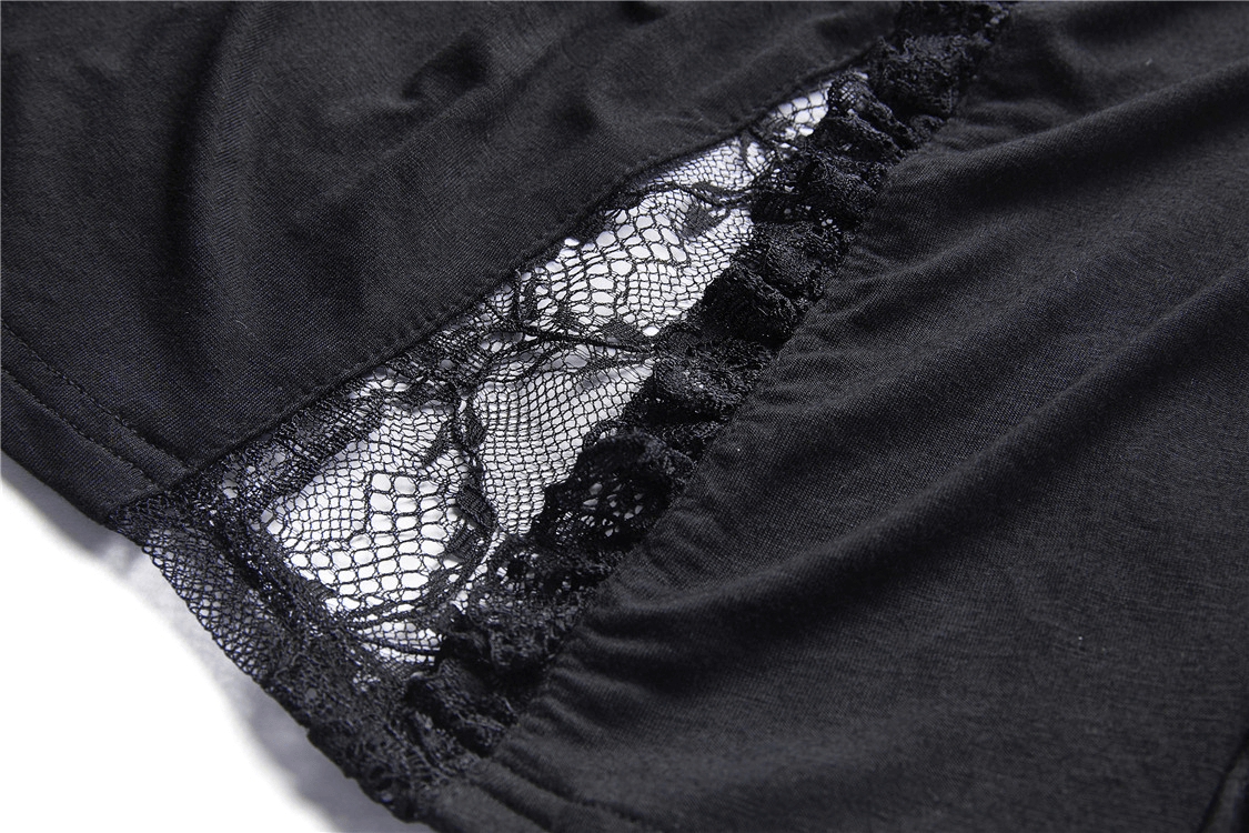 Close-up of the dark romantic black lace fabric with intricate detailing on a flared sleeve top.