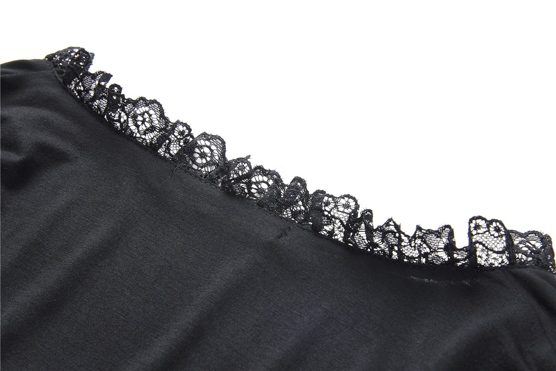 Close-up of intricate black lace detailing on the neckline of a dark romantic top.