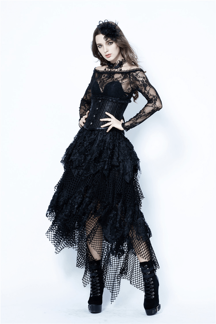 Model wearing a black high-low maxi skirt with layered mesh and lace trim, featuring edgy fishnet details.