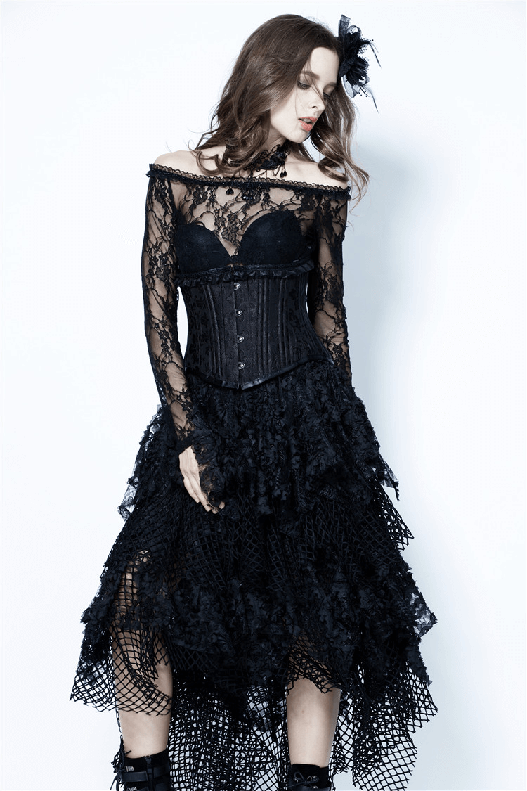 Model wearing a dark romantic layered mesh and lace high-low maxi skirt with corset and intricate detailing.