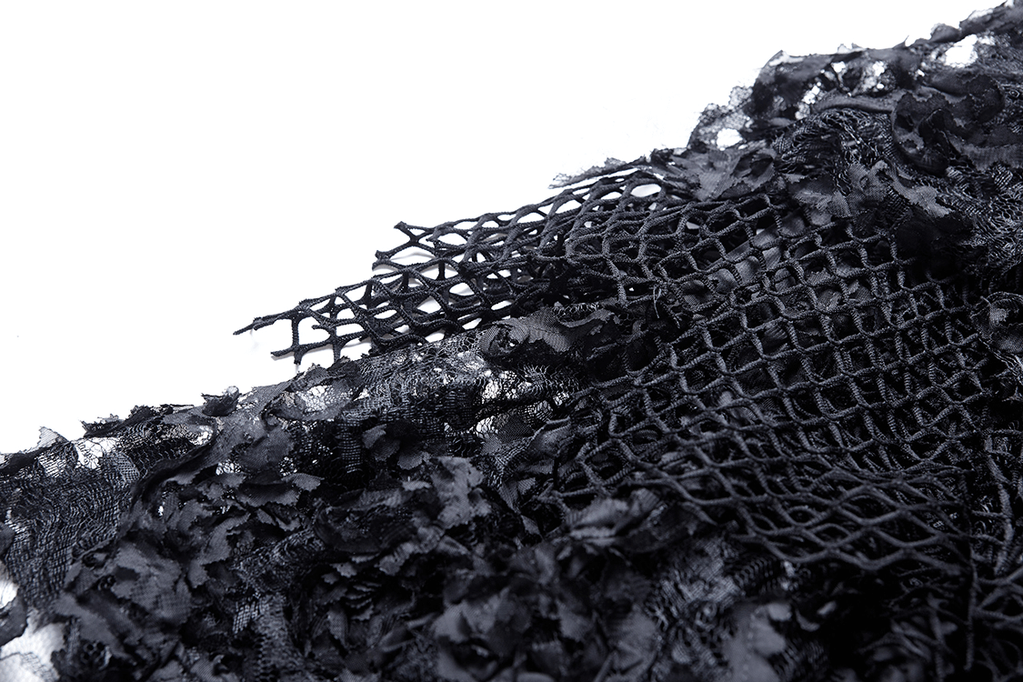 Close-up of a black layered mesh and lace fabric, showcasing the intricate fishnet and floral lace detailing.