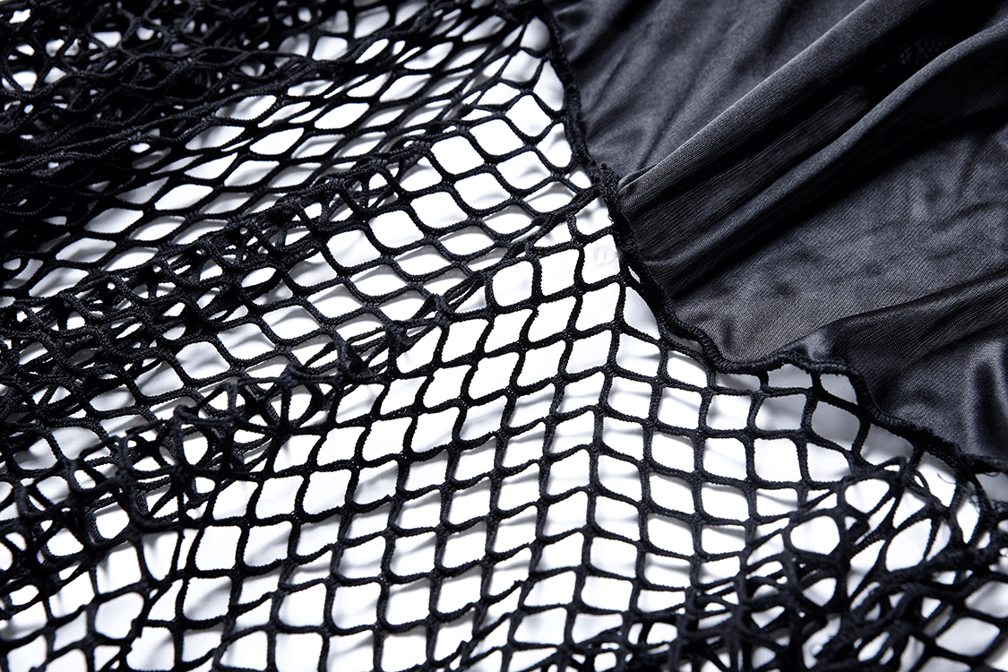 Close-up of black fishnet mesh overlay on a layered skirt, showcasing edgy design and intricate lace details.