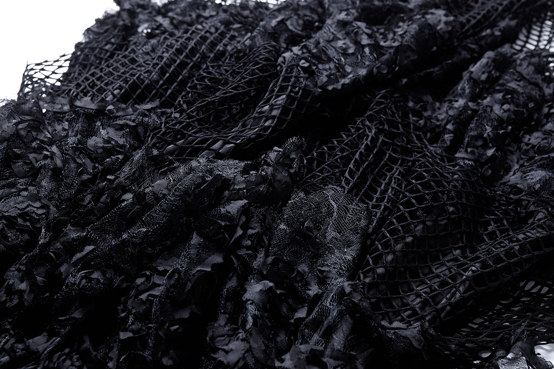 close-up of dark layered mesh and lace fabric showcasing black fishnet and floral textures for a dramatic look