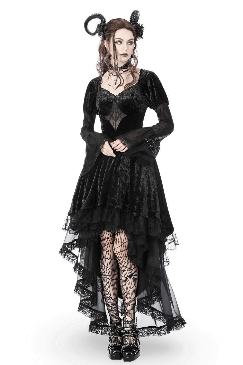 Gothic black velveteen high-low dress with spiderweb lace, model wearing striking dark queen look.