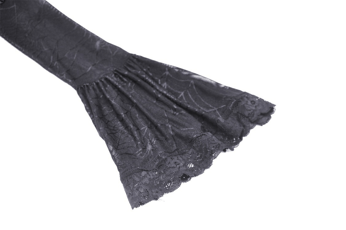Close-up of dark velveteen sleeve with spiderweb lace detailing for gothic elegance.